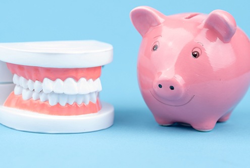 Dentures and piggy bank, understanding the cost of dentures in McMinnville