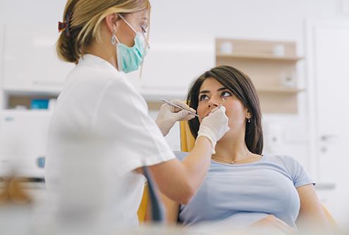 A young woman about to receive treatment for gum disease